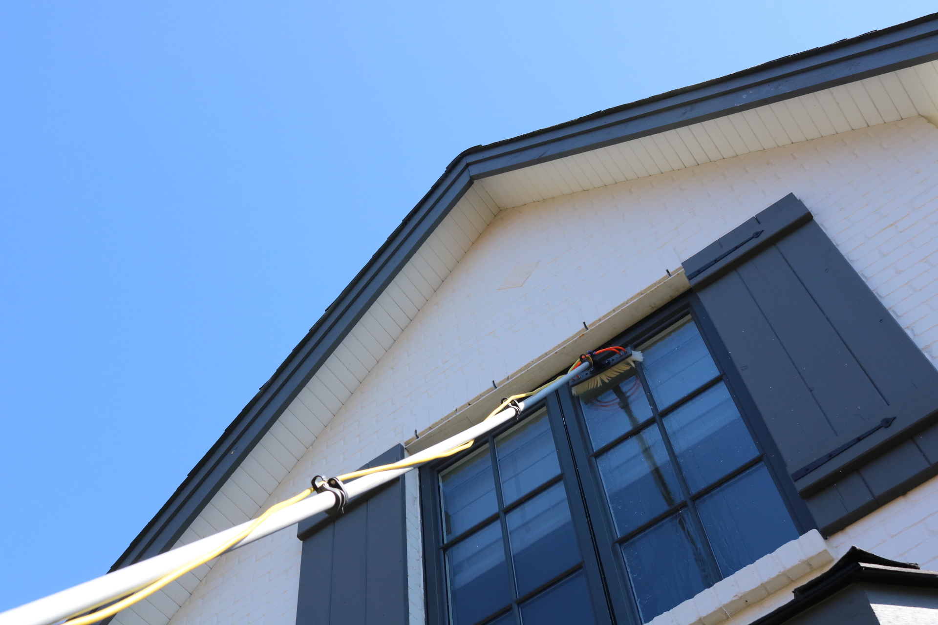 Residential window washing service for a two-story home in Timberlea.