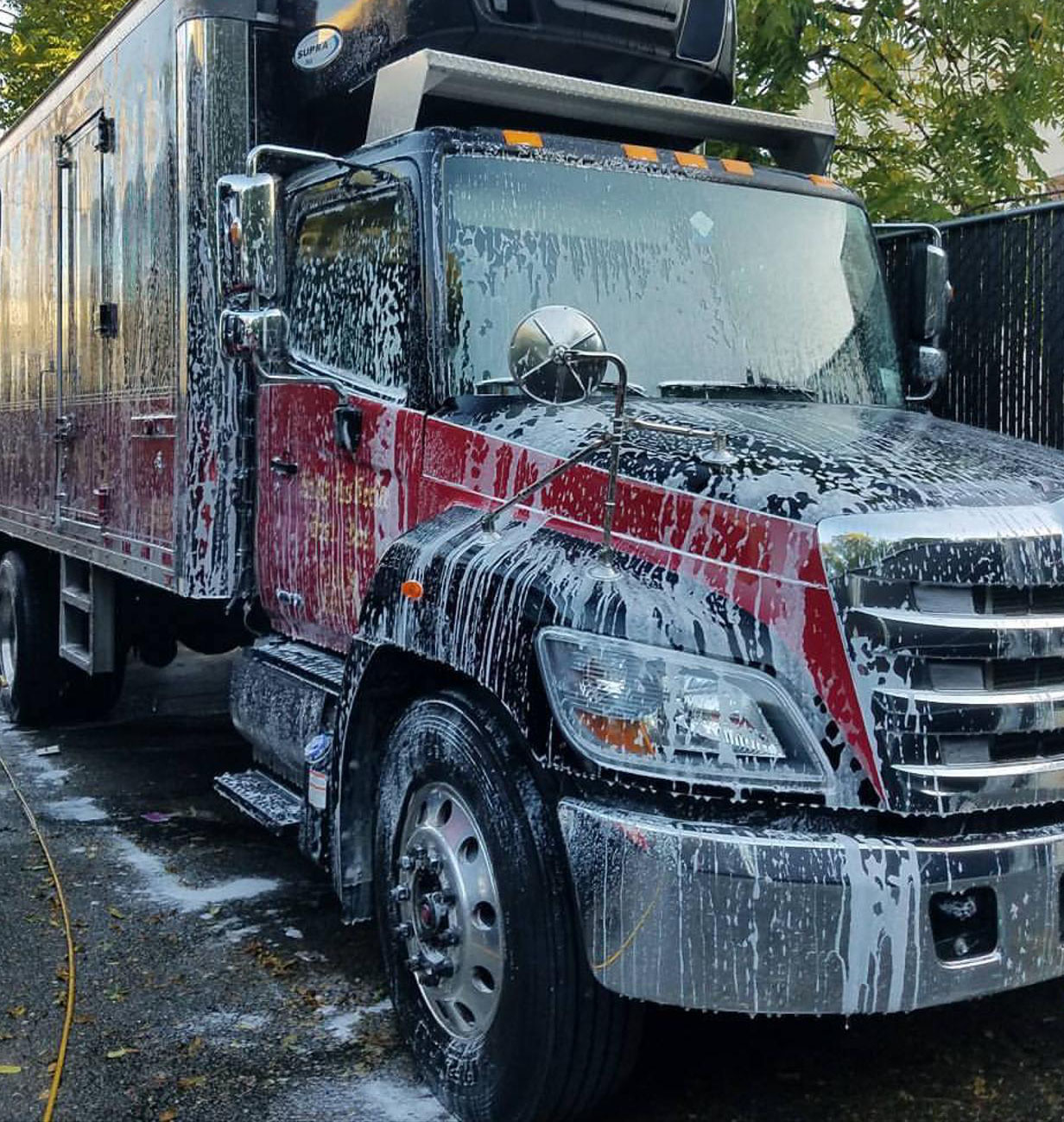 Soapy transport in for a fleet wash by ProCare Halifax.