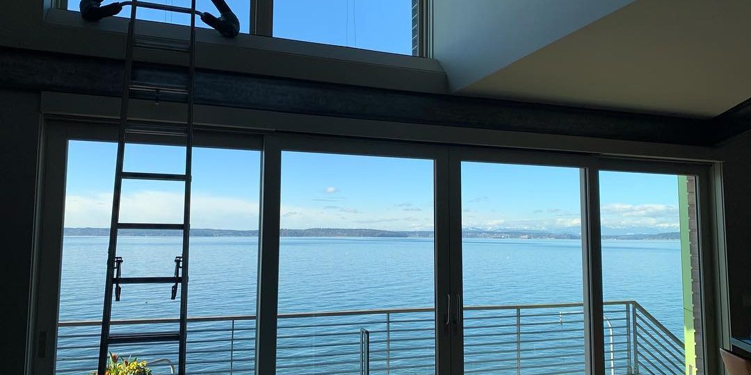 nterior view through a freshly cleaned window overlooking the ocean.