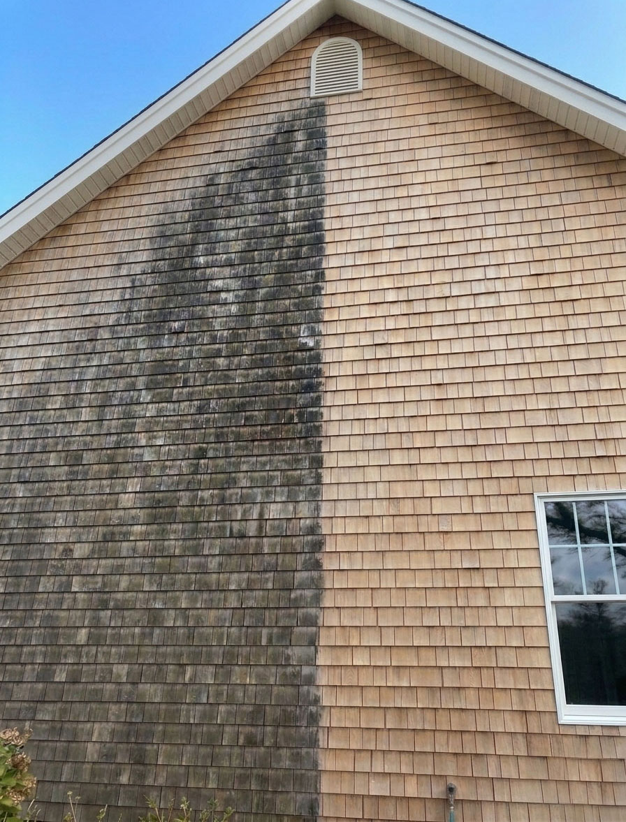 This transformation highlights our specialized soft wash process on a residential cedar exterior in Dartmouth. We safely removed years of oxidation and biological growth, restoring the shingles' original warmth and preserving the wood without the use of high pressure.