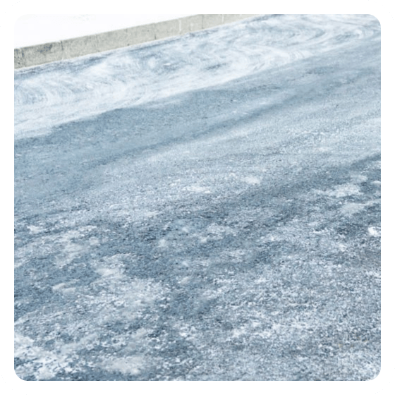 Salt stained driveway after winter pressure washing Halifax
