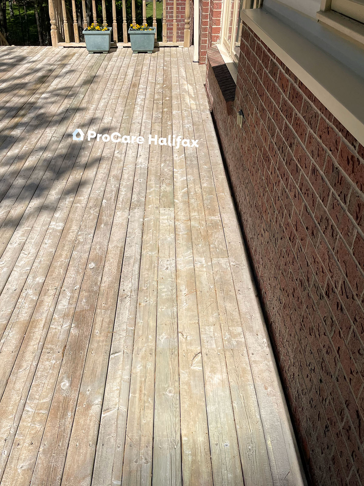 Restored wooden deck in Halifax Nova Scotia cleaned by ProCare Halifax with stains removed and natural wood finish fully revived