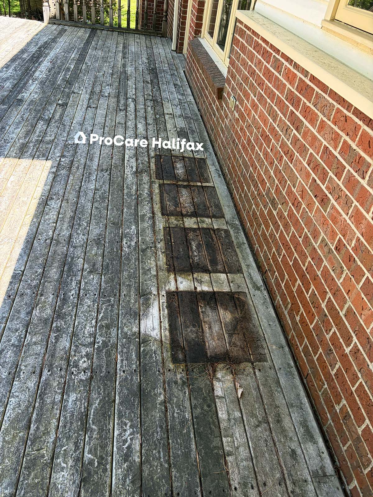 Weathered gray wooden deck in Halifax Nova Scotia with planter stains and surface discoloration before restoration by ProCare Halifax